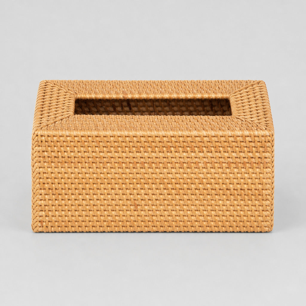 Woven rattan tissue box cover in Natural on a light gray studio background, in its Rectangular shape