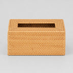 Woven rattan tissue box cover in Natural on a light gray studio background, in its Rectangular shape