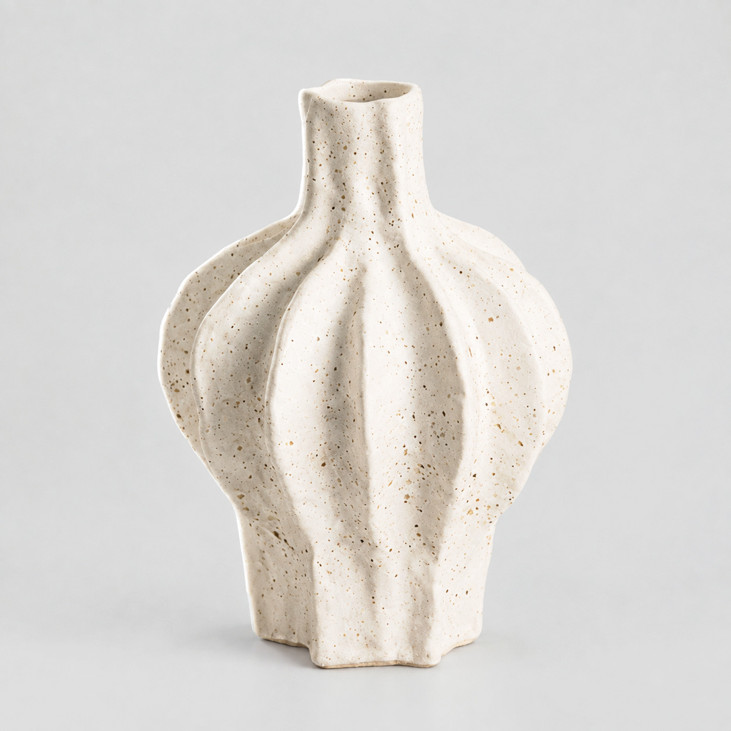 Short fluted ceramic vase in Speckled White on a light gray studio background.