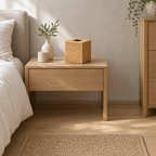 Square woven rattan tissue box cover in Natural Rattan on a 48 cm wide oak bedside table in a calm room