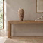 Weathered ceramic vase in Dark Brown on an oak console table in a calm room.