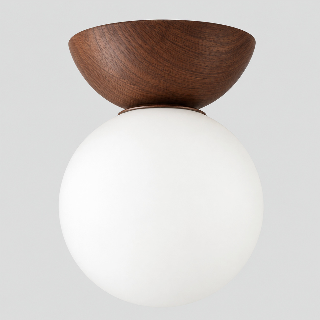 Walnut flush mount ceiling light with an opal glass globe shade on a light gray studio background.
