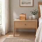 Square acacia wood tissue box cover on a 48 cm wide oak bedside table in a calm room