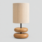 Natural Wood stacked wood table lamp on a light gray studio background