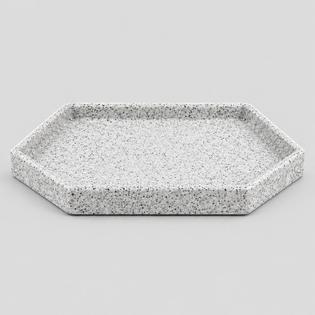 Speckled ceramic catchall tray in Speckled White on a light gray studio background, in its Hexagon shape