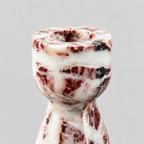 Close up of the rounded marble rim at the top of the Burgundy Marble vase-shaped marble candle holder