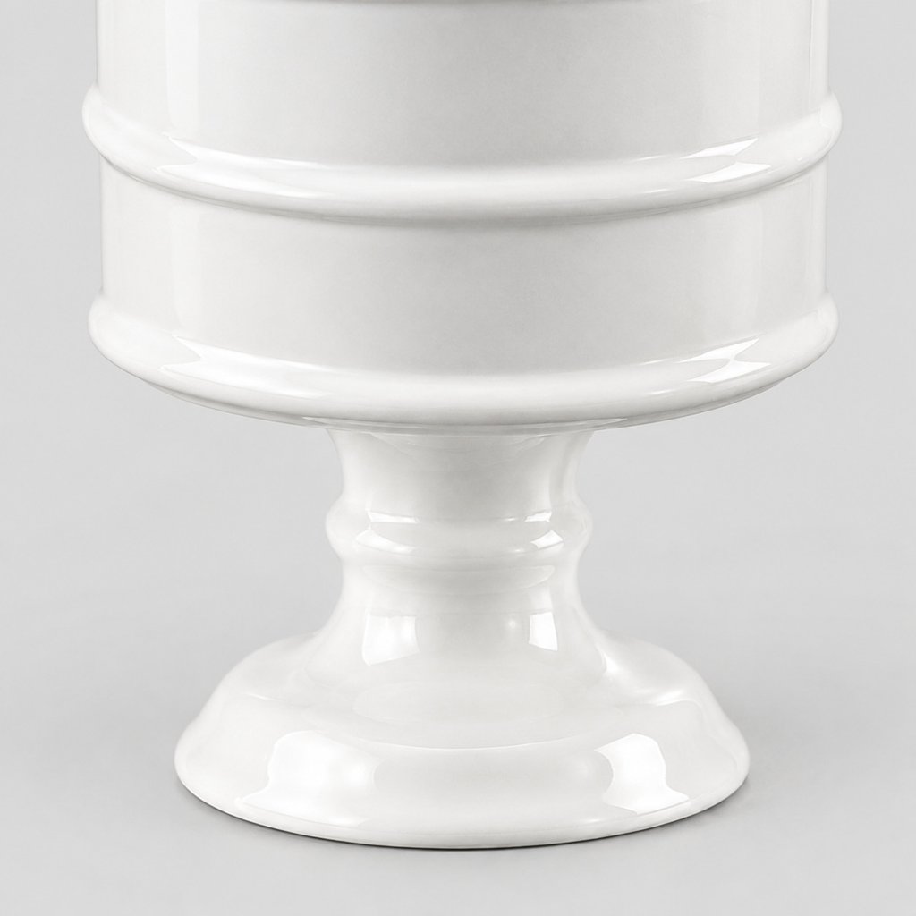 Close up of the curved pedestal foot of the Glossy White ceramic pedestal candle vessel.