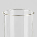Close up of the flared rim of the clear glass shade of the hurricane candle holder.