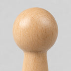 Close up of the smooth beech wood grain surface texture of the turned beech wood wall peg.