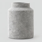 Weathered Gray ceramic jar vase on a light gray studio background.