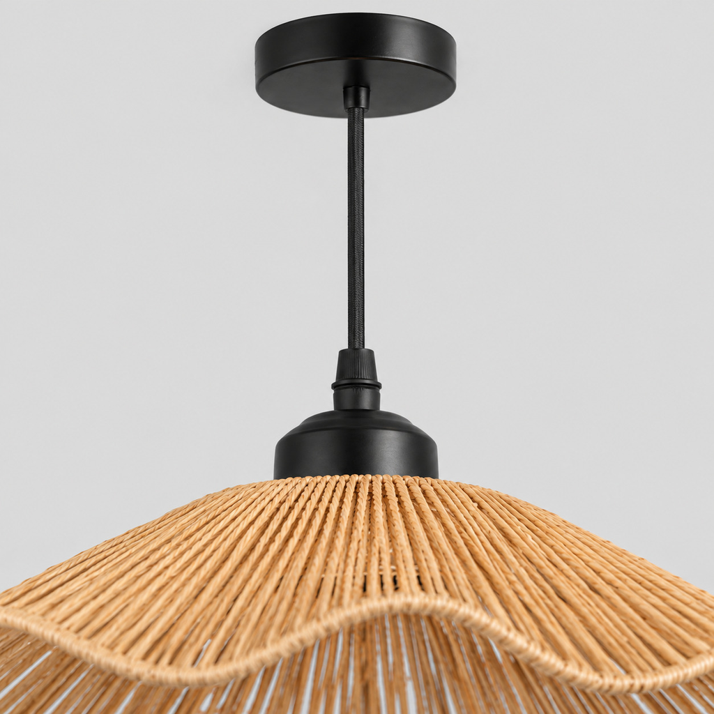 Close up of the round canopy against the wall of the wavy woven rattan pendant light