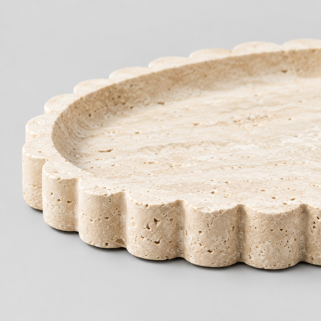 Close up of the scalloped rim of the scalloped oval travertine tray