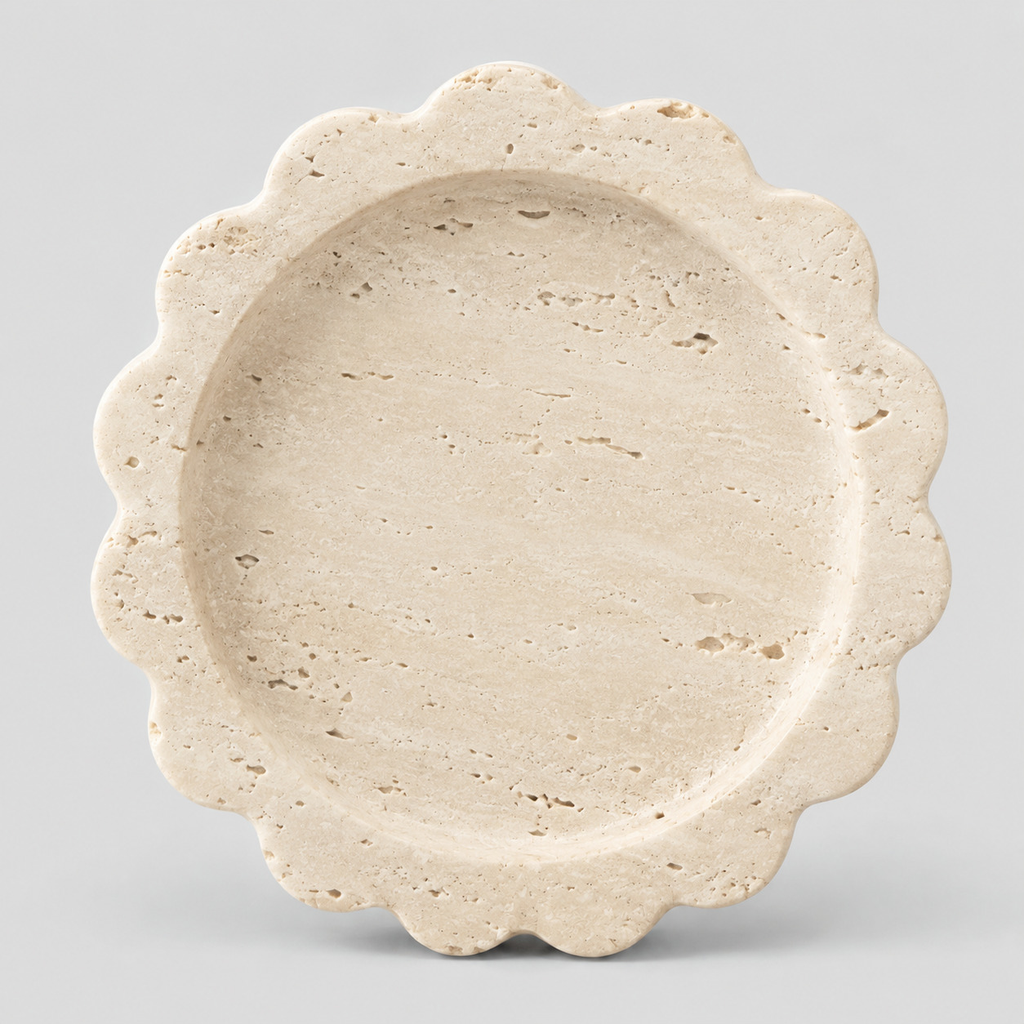 Scalloped stone trinket tray in Beige Travertine on a light gray studio background.