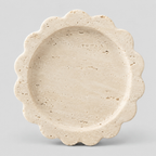 Scalloped stone trinket tray in Beige Travertine on a light gray studio background.