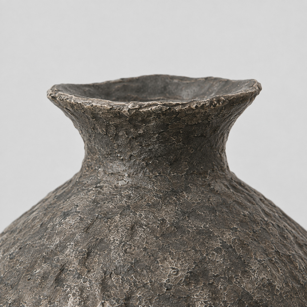 Close up of the flared rim of the textured ceramic urn vase in Charcoal finish
