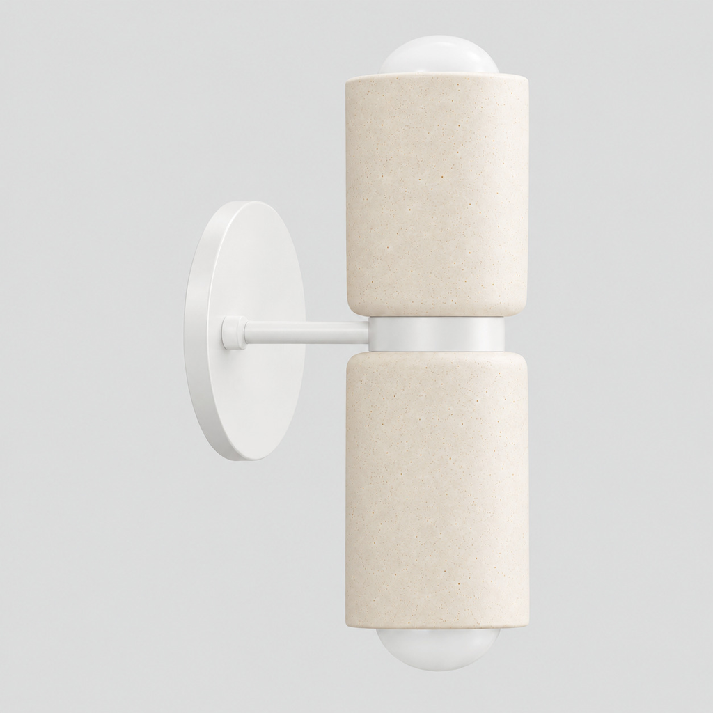 Dual-light ceramic wall sconce in a white finish on a light gray studio background