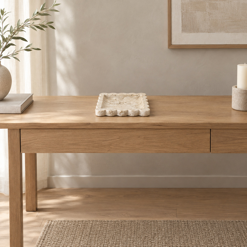 Scalloped square stone tray in Yellow Travertine on a 120 cm wide oak console table in a calm room.