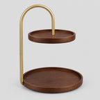 Two-tier round wooden serving tray in Ebony on a light gray studio background.