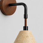 Close up of the arm joint or hinge of the conical travertine wall sconce in Travertine