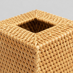 Close up of the thick braided rim along the upper perimeter of the woven rattan cube tissue box cover