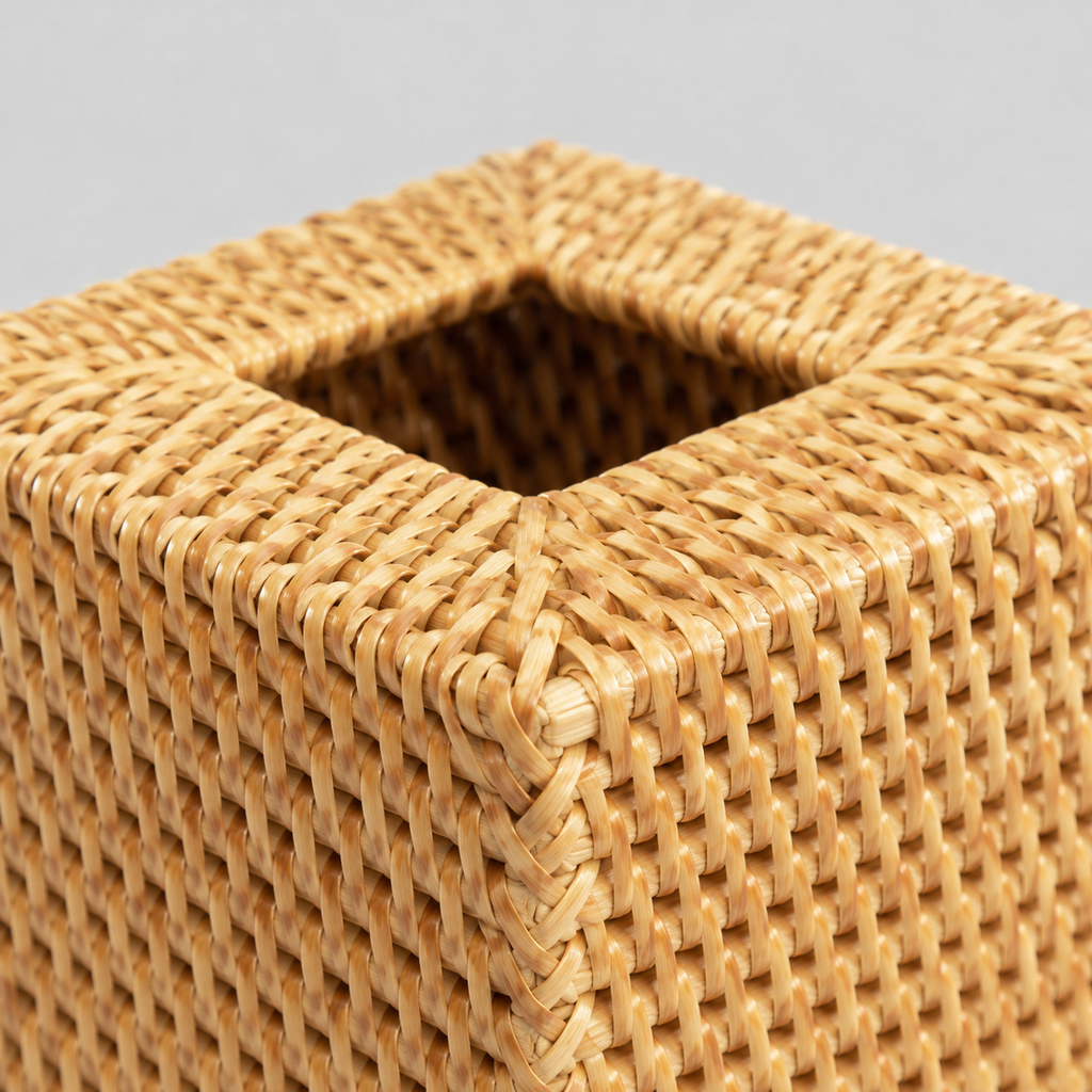 Close up of the thick braided rim along the upper perimeter of the woven rattan cube tissue box cover