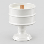 Glossy White ceramic pedestal candle vessel on a light gray studio background.