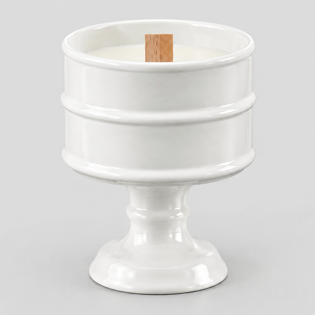 Glossy White ceramic pedestal candle vessel on a light gray studio background.