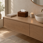 Walnut wooden tissue box cover on a 90 cm wide bathroom vanity beside a folded towel with a white tissue pulled through the slot
