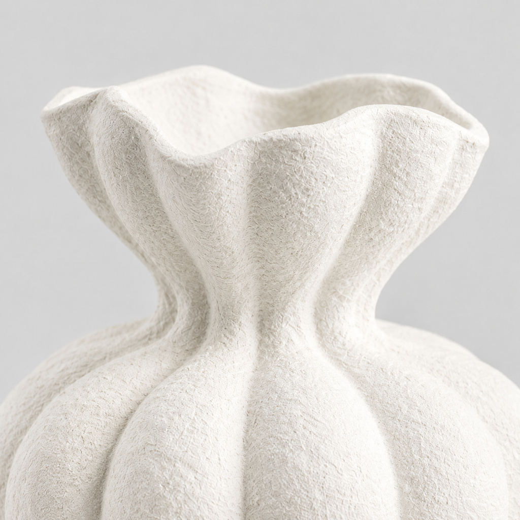 Close up of the ruffled petal rim of the fluted ceramic vase in Matte White.