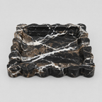 Scalloped square stone tray in Black Marble on a light gray studio background.