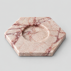 Rose Marble hexagonal marble candle holder on a light gray studio background.