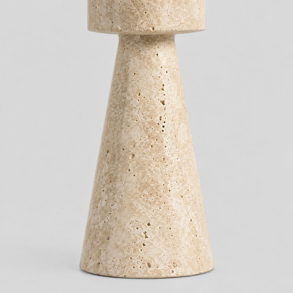 Close up of the flared conical base of the travertine stone candle holder