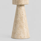Close up of the flared conical base of the travertine stone candle holder