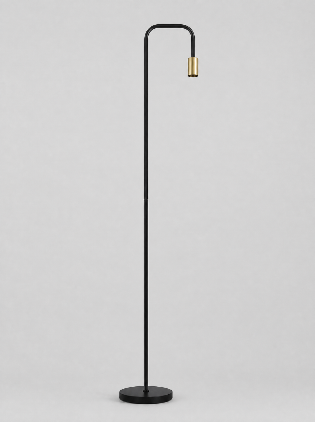 Black floor lamp with a curved arm and an open brass socket on a light gray studio background