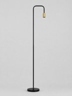 Black floor lamp with a curved arm and an open brass socket on a light gray studio background