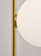 Close up of one opal globe where it meets the brass pole