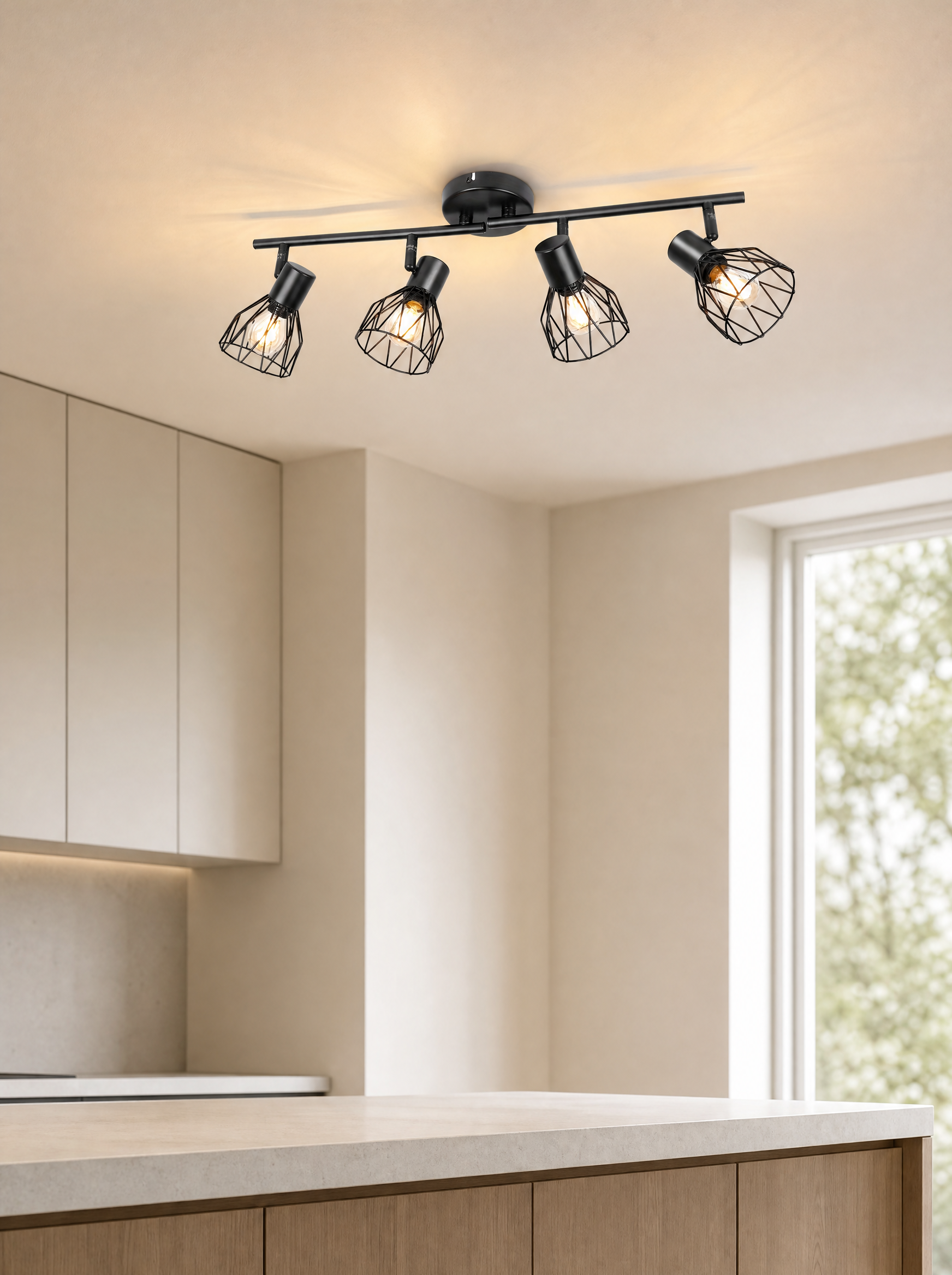 Black cage spot bar lit on a kitchen ceiling above a counter