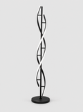 Black double helix LED floor lamp on a light gray studio background