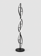 Black double helix LED floor lamp on a light gray studio background