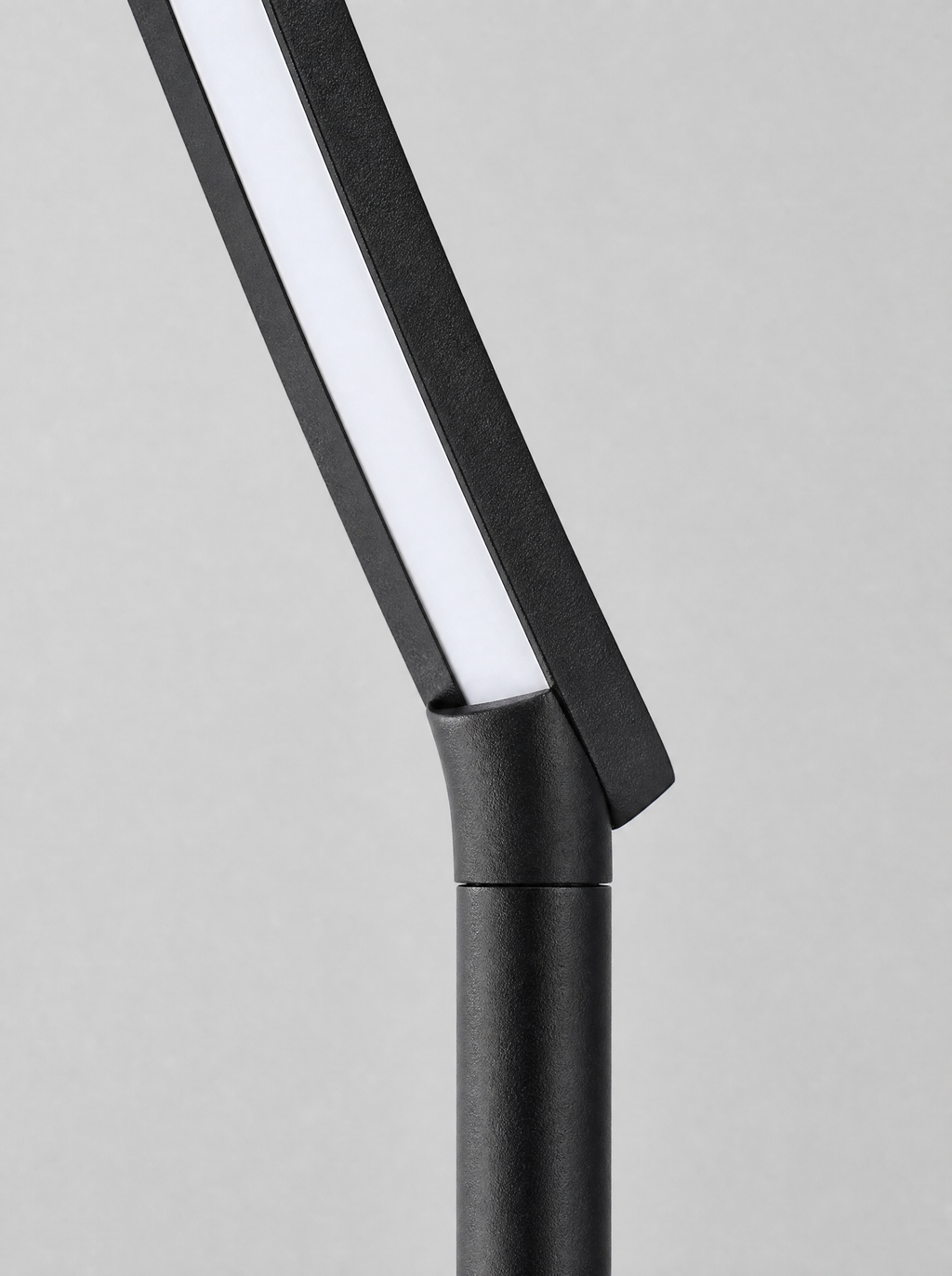 Close up of the flat LED arm and the joint where it meets the pole