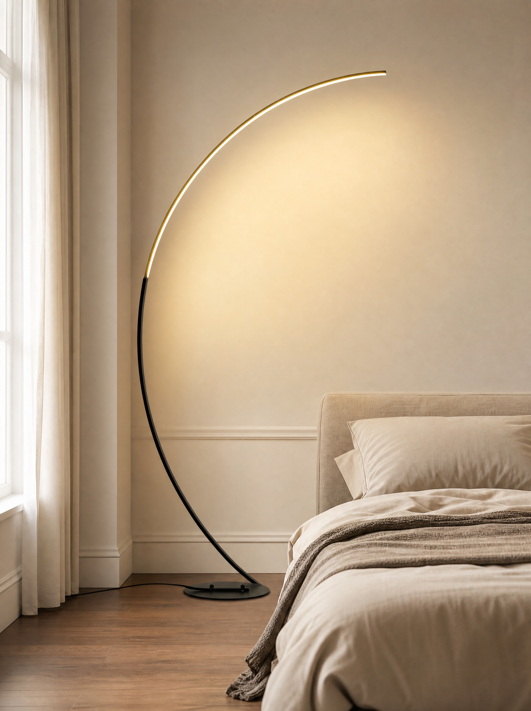 LED arc floor lamp lit over a bed in a quiet bedroom
