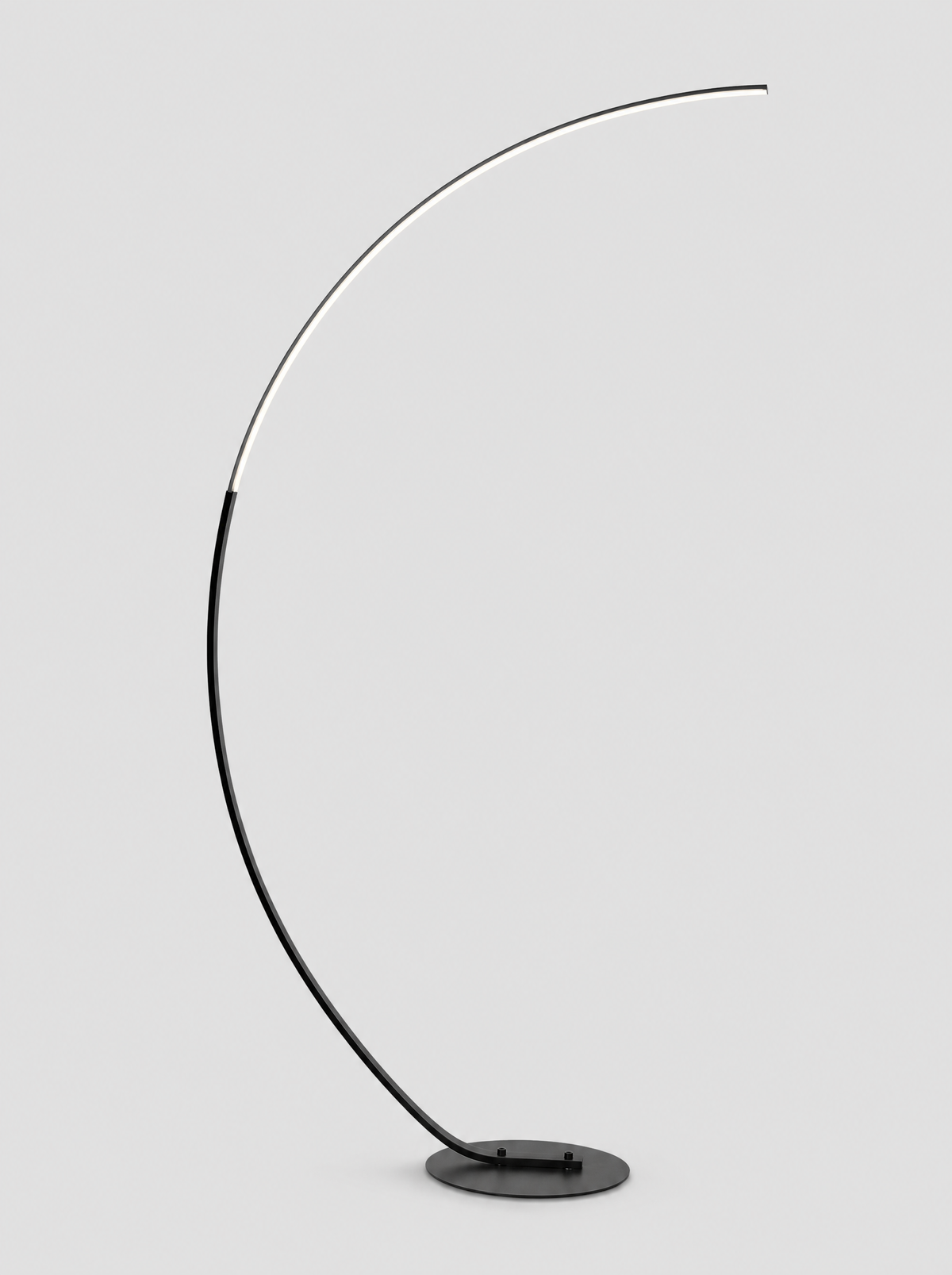 Black LED arc floor lamp with a flat curved light arm on a light gray studio background