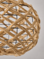 Close up of the crossing rattan strands and the open gaps in the weave