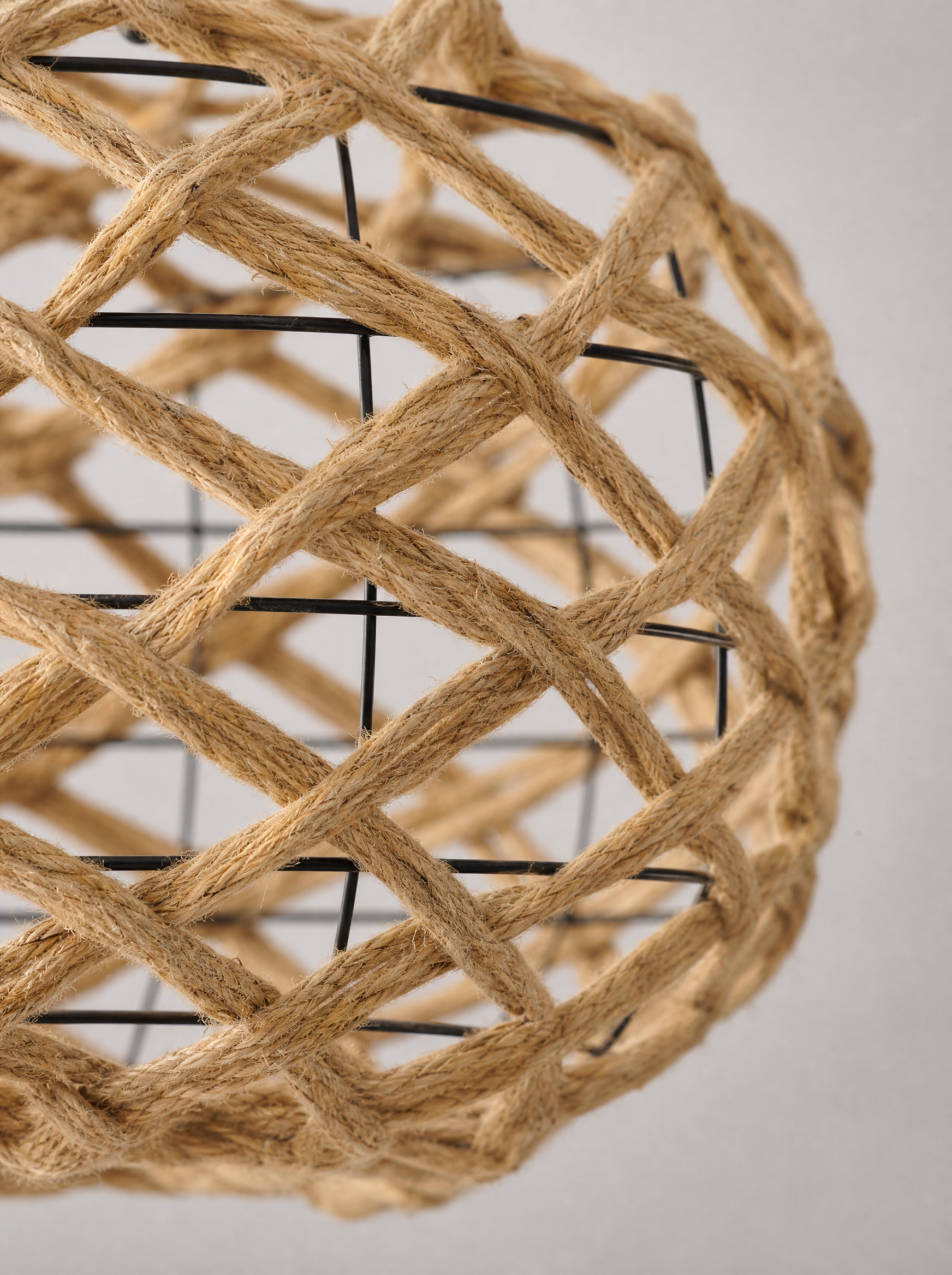 Close up of the crossing rattan strands and the open gaps in the weave