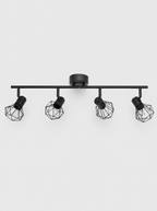 Black four head ceiling spot bar with rounded wire cage shades on a light gray studio background
