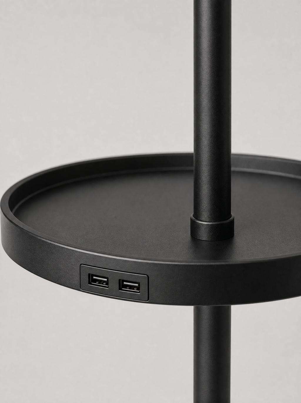 Close up of the round tray and the two USB ports set into the pole