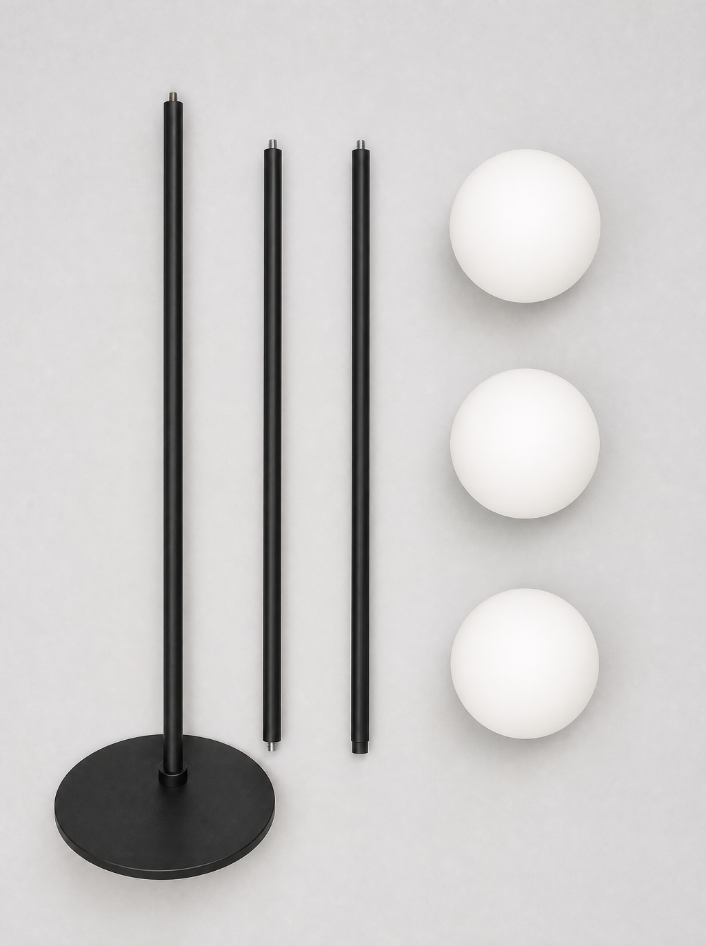 What is in the box for the three globe floor lamp, pole sections, base and three opal globes