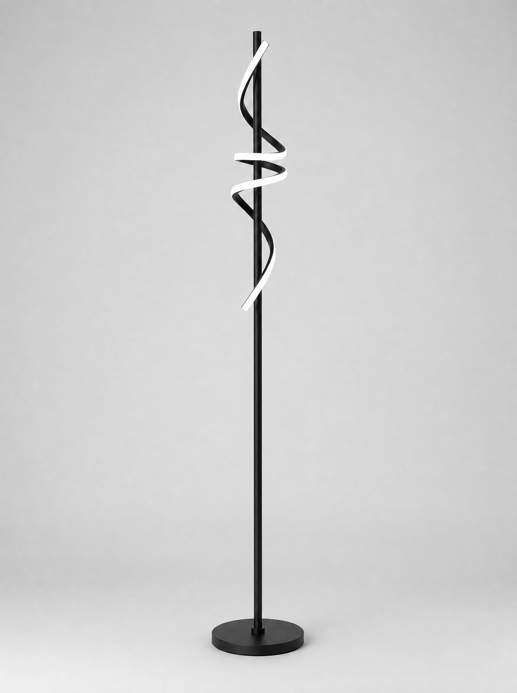 Black twisted ribbon LED floor lamp on a light gray studio background