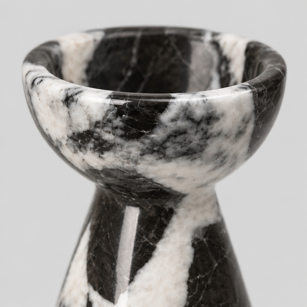 Close up of the smooth polished rim of the Black Marble pedestal candle holder.