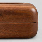 Close up of the horizontal seam between the top and bottom wooden sections of the rounded wooden tissue box cover